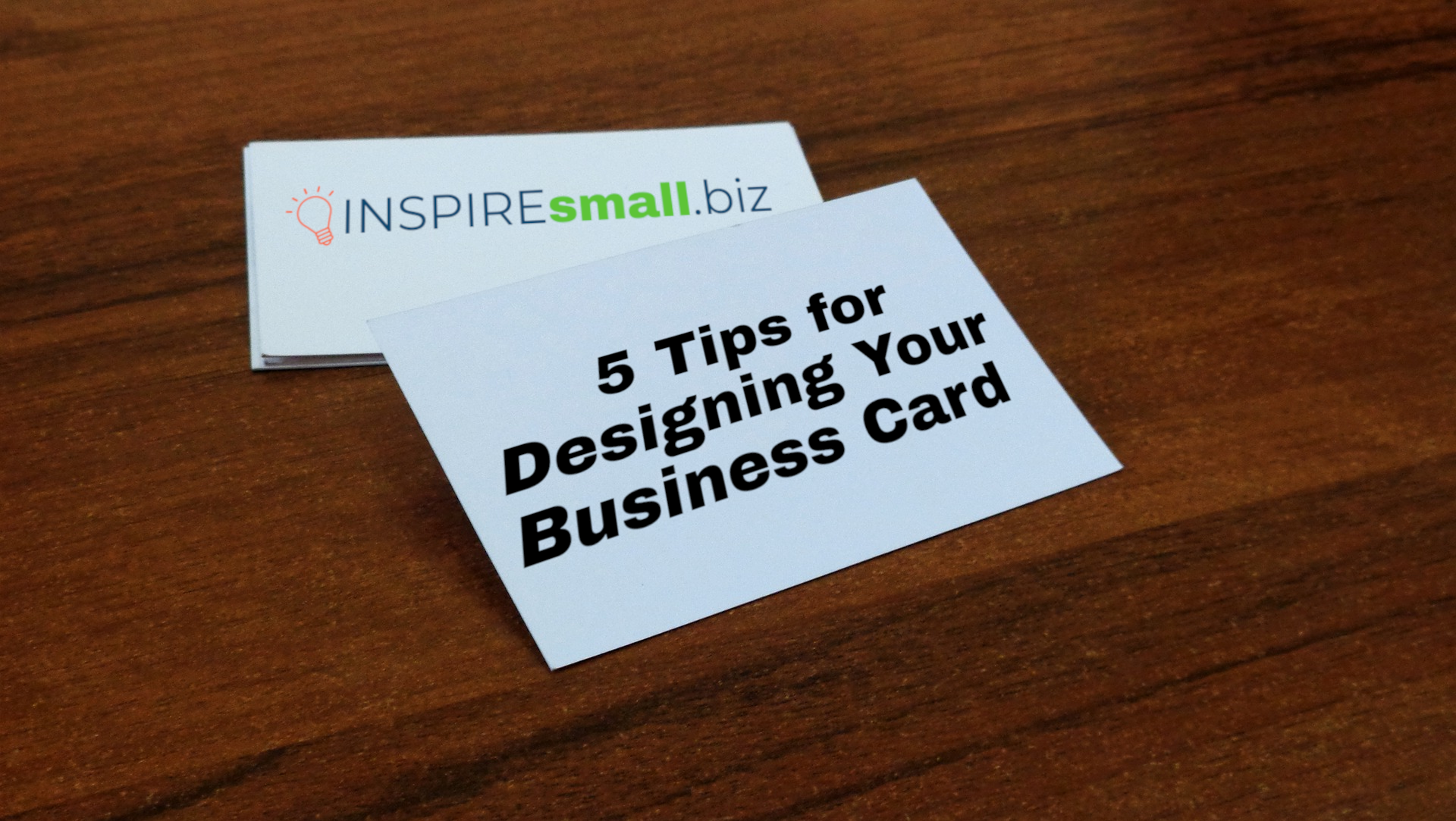A stack of business cards with the INSPIREsmall.biz logo and the text '5 Tips for Designing Your Business Card'
