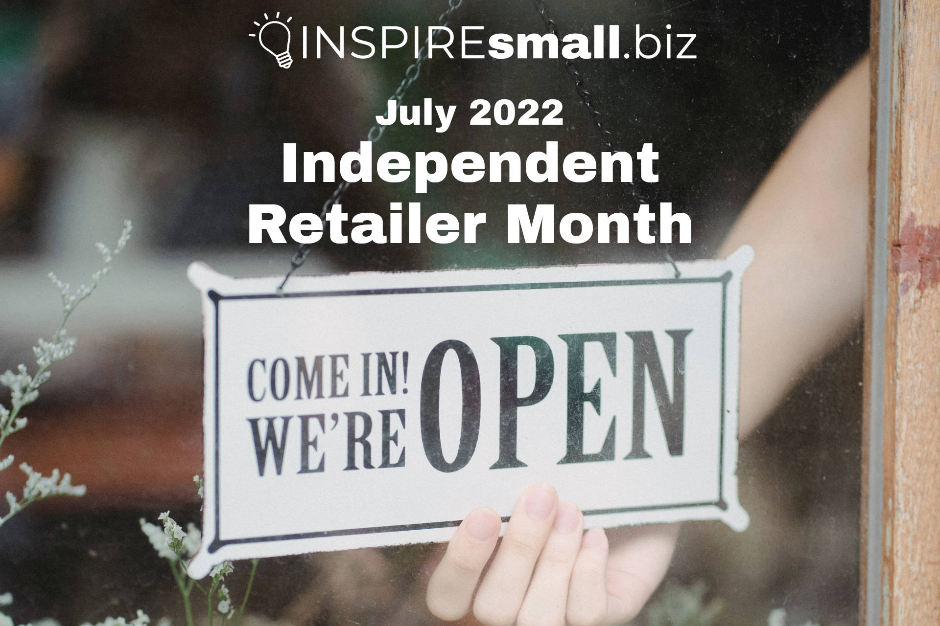 July is Independent Retailer Month, events from INSPIREsmall.biz. A background image of a person flipping an open sign to open in a shop front window.