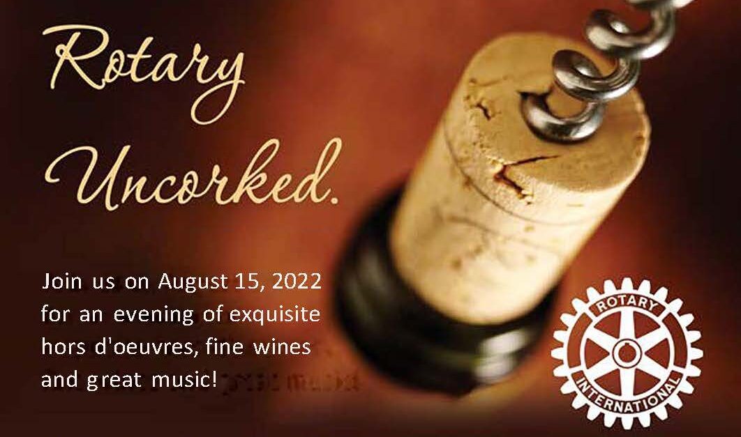 Picture of wine bottle with cork opener inserted with the Rotary International logo displayed with the words 'Rotary Uncorked'